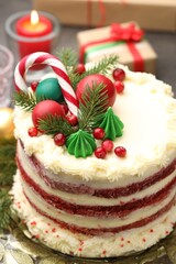 Tasty cake with Christmas decor on grey table, closeup