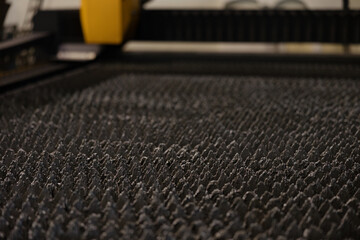 Innovative machinery working on boiler components in an unfinished facility at night