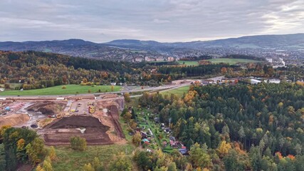 earth excavation and progress tracking, aerial perspective of building area and site activities