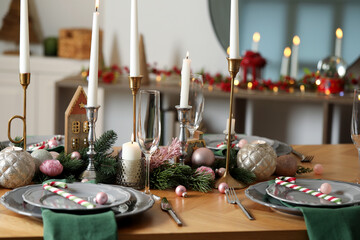 Festive table setting with Christmas decor at home, closeup