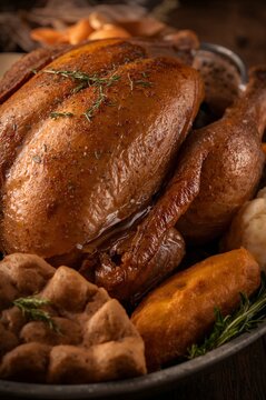 Close-Up of Traditional Thanksgiving Turkey and Side Dishes on Rustic Table	