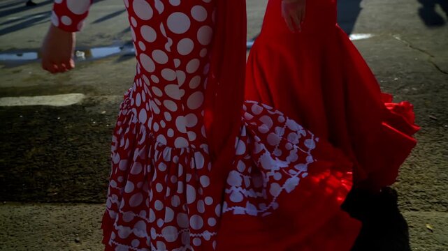flamenco dresses shine under golden hour at the Seville fair, full of ruffles and color