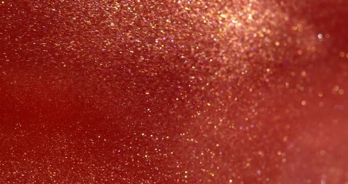 Abstract waves texture. Glitter in red liquid abstract background. Metallic red texture, swirls.