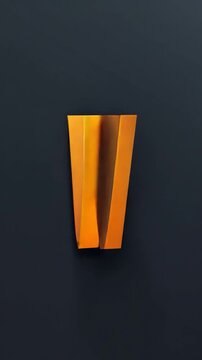 A golden letter W on a dark background