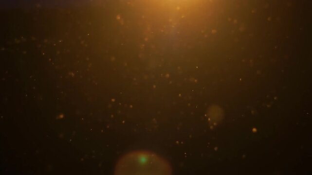 Floating dust particles in soft warm backlight