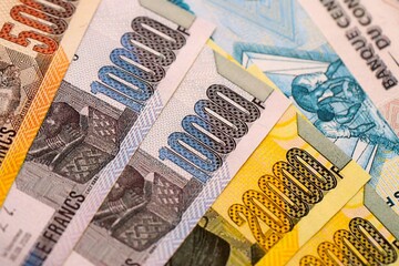 Congolese franc money bills in big amount on table close up. Rich life concept in Democratic Republic of Congo. Business and economy