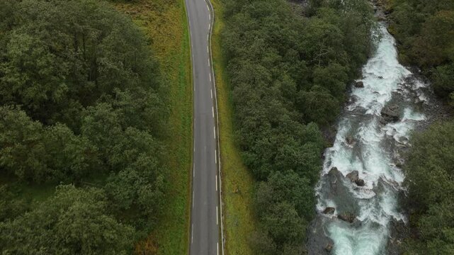 Drone view of goats halting traffic on remote mountain road, Norway
