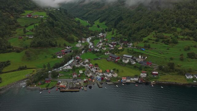High-angle view of Undredal village by fjord and cliffs in western Norway