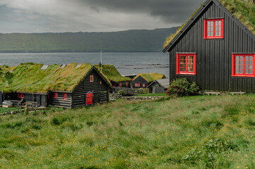Charming Faroese Village Scene with Grass-Roof Cottages in Kirkjubour, Faroe Islands