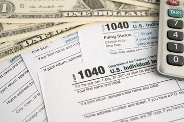 Obraz premium Tax form 1040 U.S. Individual Income Tax Return and bitcoin, business finance, Digital currency, Virtual cryptocurrency.