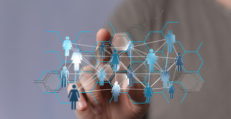 Hand touching digital interface, showing connection between people and networks, community and global access.