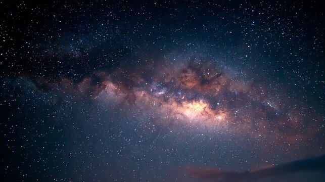 Vast milky way galaxy illuminated with countless stars and cosmic dust clouds in deep space