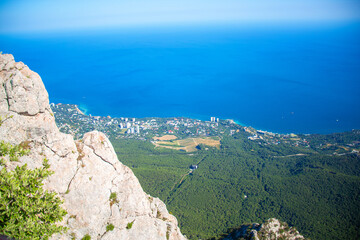 View from the highest peak of the mountain to the valley, plateau and sea. Crimean Mountains, Ai-Petri, Ai-Petri yayla
