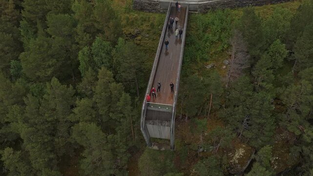 Scenic aerial of Stegastein lookout with visitors enjoying panoramic views, Norway