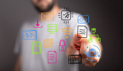 Hand pointing at colorful digital icons,data, network, cloud, security, communication, technology concept.