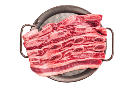 Uncooked cross-cut beef ribs arranged in a dark metal tray, emphasizing a gourmet or home cooking preparation.