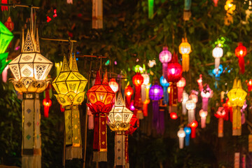 Vibrant Lanna lanterns illuminate the night during a traditional Yi Peng festival in Chiang Mai,...