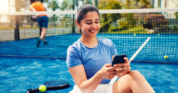 Padel, typing and woman on court with phone, match schedule and social media update on rest. Tennis, fitness and athlete on turf with tech, wellness chat and virtual tutorial on training break.