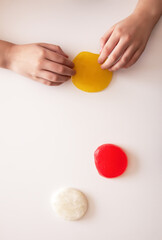 Vibrant slime play in a child’s hands. A joyful and creative sensory activity.