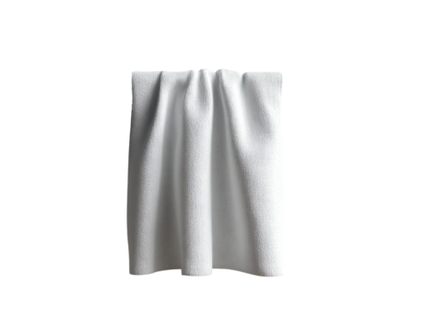 Draped white fabric with folds and soft texture against black backdrop