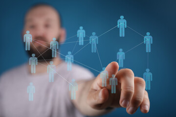 Close-up of a man's hand interacting with a holographic representation of a social network, teamwork and connection,  blue background