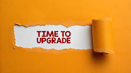 Time to upgrade message behind torn orange paper, representing growth and improvement in business and personal life, urging advancement