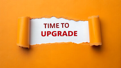 Time to upgrade message appearing behind torn orange paper, symbolizing growth and improvement in business and personal life, urging action