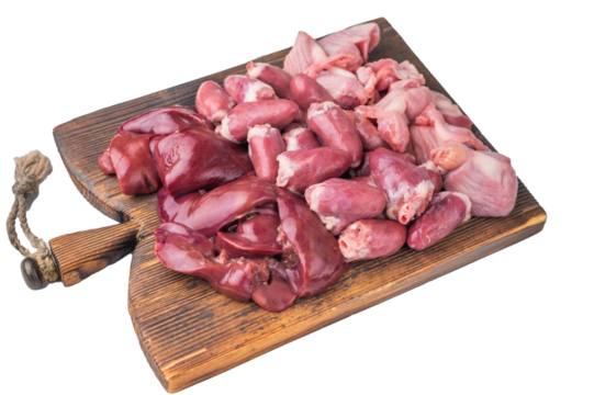 Raw chicken hearts, liver, gizzards on a rustic wooden board  clean white background accentuates meat textures.