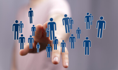 Digitally generated human figures are interacting with a finger, representing connection and team work on a blu