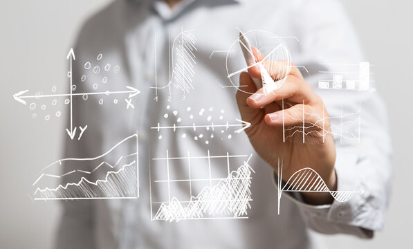Business person analyzing and drawing data graphs. Concept of business intelligence, market analysis, or financial planning. - Powered by Adobe