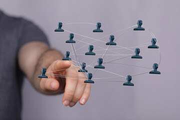 Visual representation of interconnected networks, highlighting digital communication and teamwork. Showing human connections with figures and ha