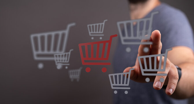 Person interacting with digital shopping cart icons, representing online shopping and e-commerce. Ideal for illustrating digital retail and cons