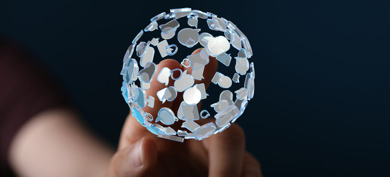 Concept of global connection, social media network, and digital communication. A hand holds a transparent sphere made up of chat bubb
