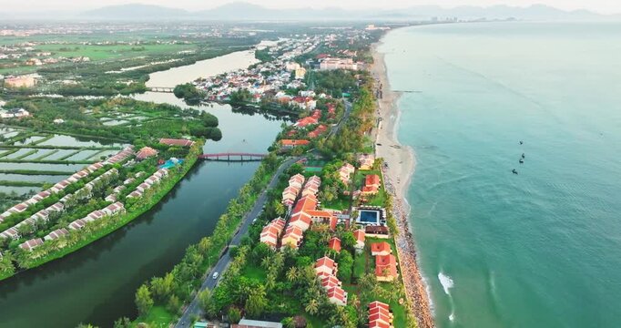 Aerial view of Cua Dai bay in Hoi An ancient town, Vietnam. Agricultural development texture, transport infrastructure and green parks resort