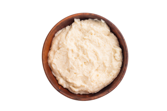 Creamy homemade horseradish sauce served in a rustic wooden bowl on a clean white background. Classic studio top view.