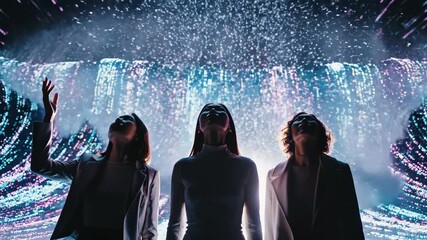 Three women are looking upwards at an immersive digital light art installation, experiencing innovation and the metaverse concept in a technological future - Powered by Adobe