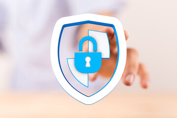 Concept image of a hand holding a shield icon with a padlock, symbolizing data security, protection, and online safety. Perfect for c