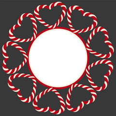 Christmas round frame surrounded by candy canes with red and white stripes. Blank vector template with copy space. Heart-shaped candy cane. Background for Christmas and New Year.