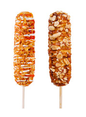Delicious corn dogs coated in toppings at a fairground in summer