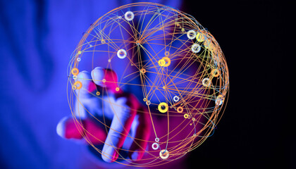 Abstract image of a hand holding a glowing sphere of interconnected nodes and lines, representing...