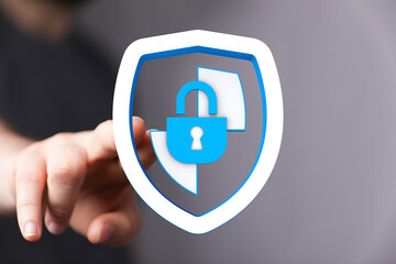 Hand pressing a digital lock icon representing data protection, information privacy, and cybersecurity. A visual metaphor for secure