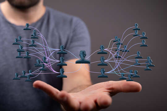 Image of a hand holding a network graphic, representing people connections, communication, and collaboration. Suitable for business, social medi