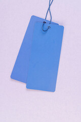 tag for indicating the price and other information, an old clothing tag that is not filled in, which contains information important to customers