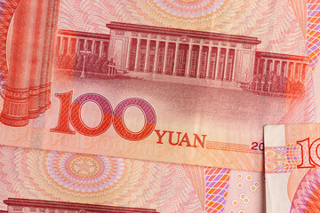 red currency of one hundred yuan used in the China close up, details of different elements of the red banknote 100 yuan
