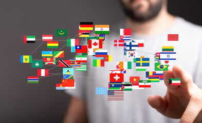Image of world flags connected, symbolizing global network, international business, and collaboration.
