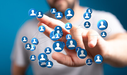 Close-up of a hand interacting with digital icons representing a social network or global connection. The image symbolizes communication and tea