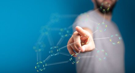 Close-up of a man's finger pointing towards digital network with connected circles. Technology, future, data an