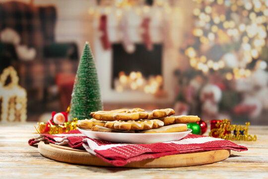 Christmas cookies on plate with festive decorations - Powered by Adobe