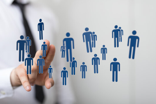 Concept of team work and global network with human figures near hand gesture