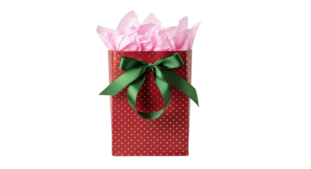 Isolated red gift bag with polka dots, green bow, and pink tissue paper for shopping occasion